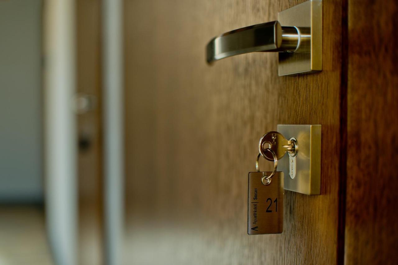 Apartsuites I Sorau Zary  Exterior photo A door with a key in the lock